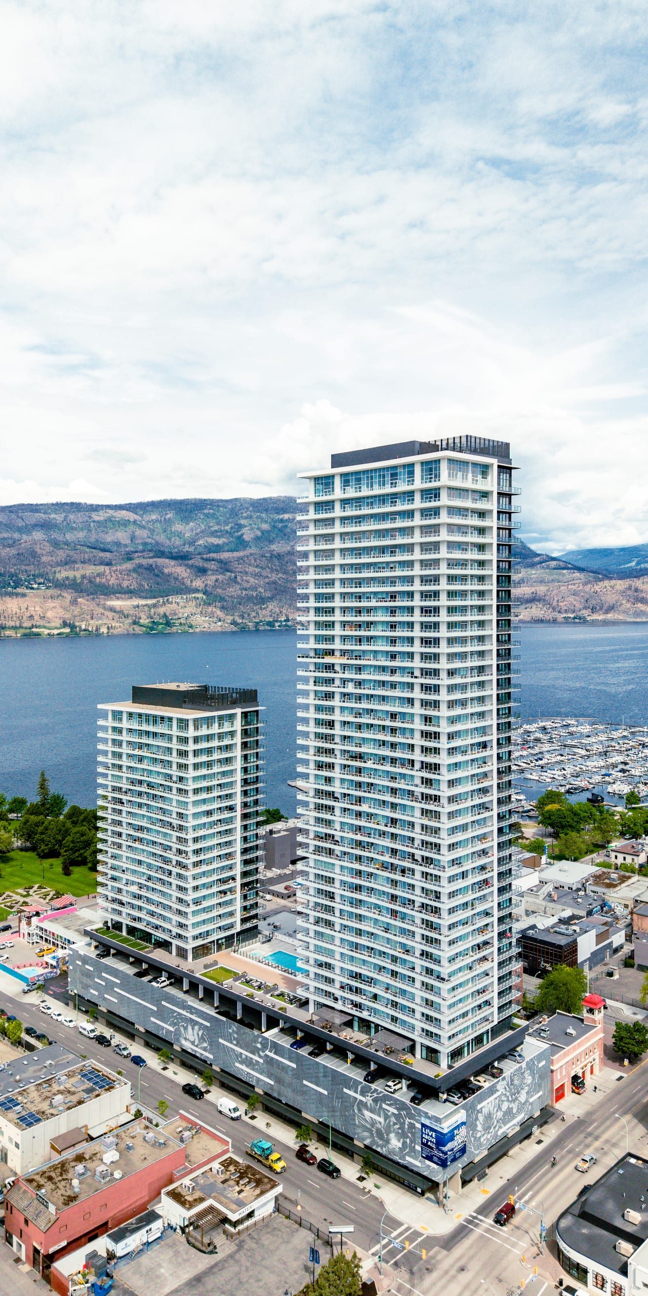 Aerial view of the Water St by the Park towers above Okanagan Lake in downtown Kelowna