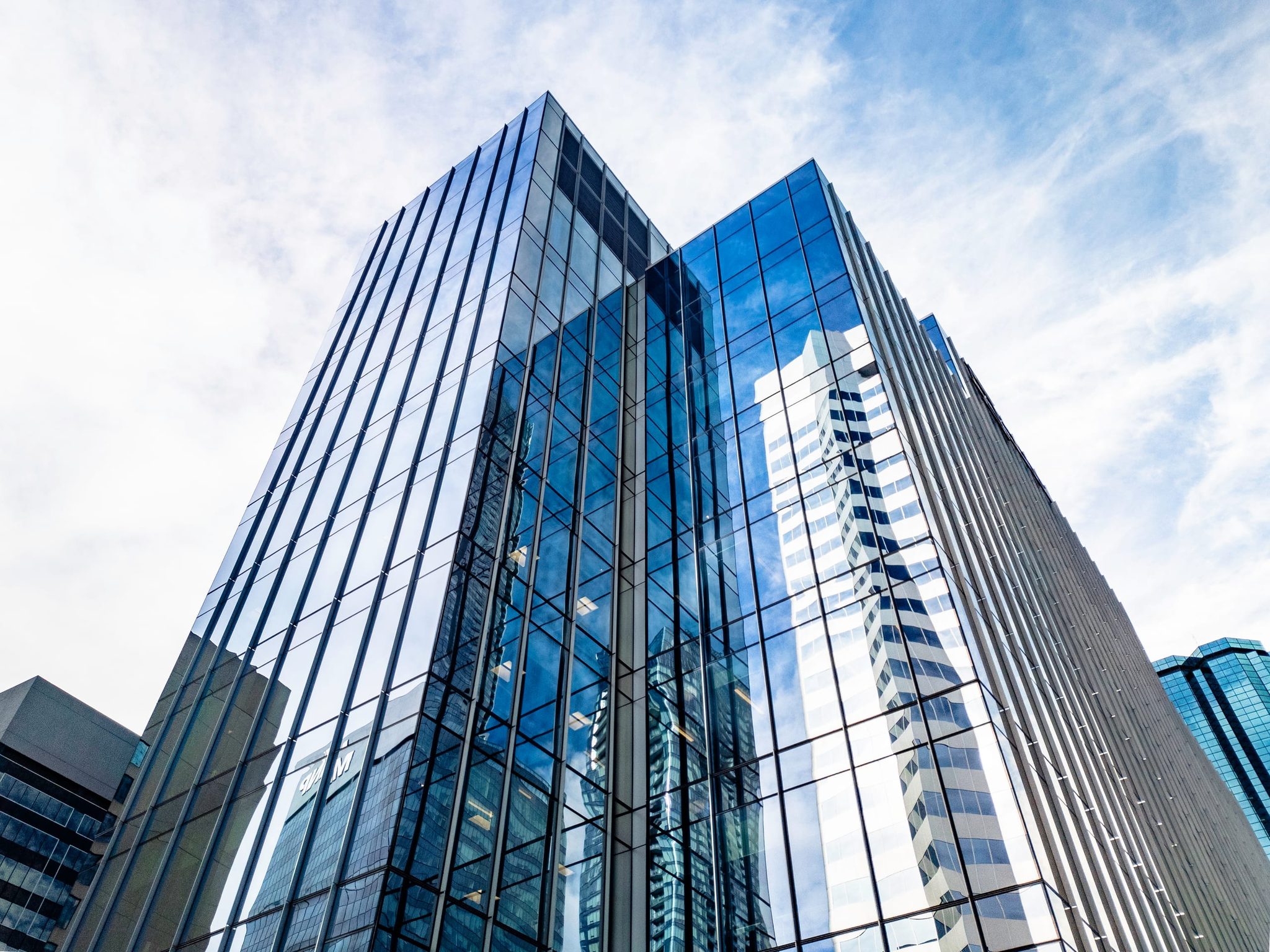 Glass office towers in downtown Edmonton, shot from street level