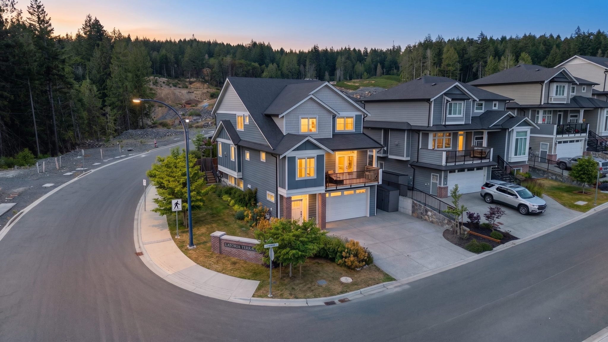 New-build residential exterior at dusk in Colwood