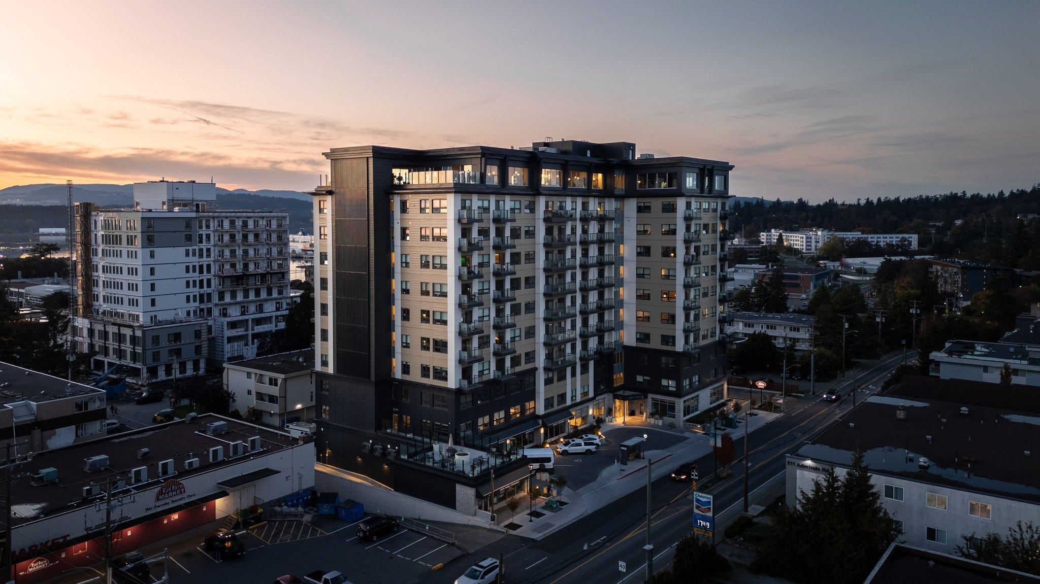 Twilight aerial view of a condo highrise tower in Victoria BC