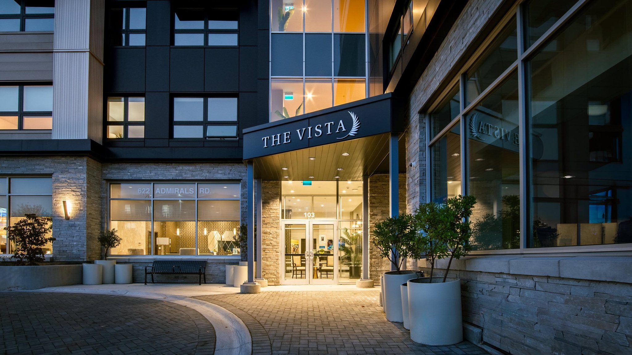 Evening entrance photo of The Vista condo building on Admirals Road