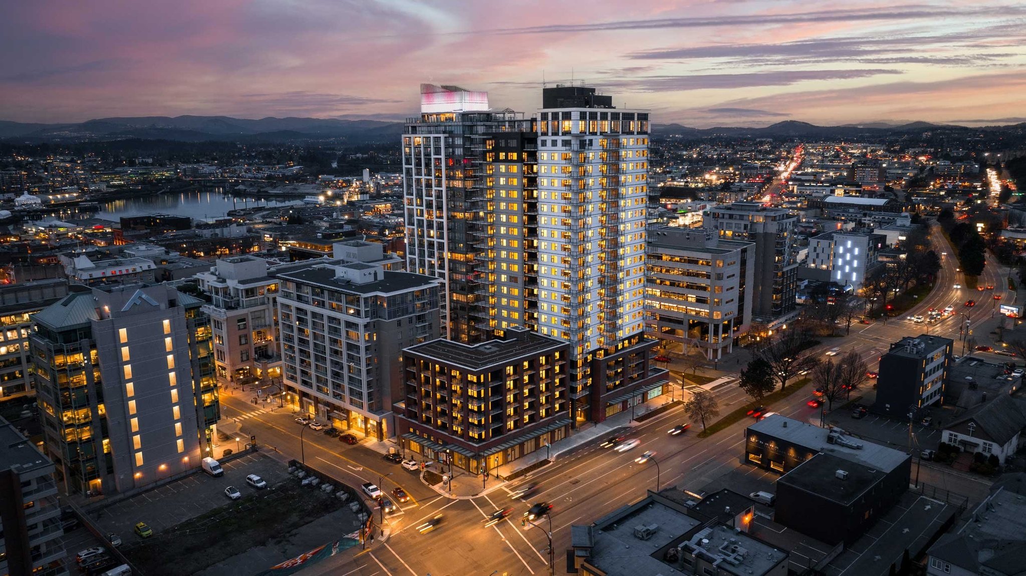 Twilight aerial view of a downtown Victoria BC condo highrise
