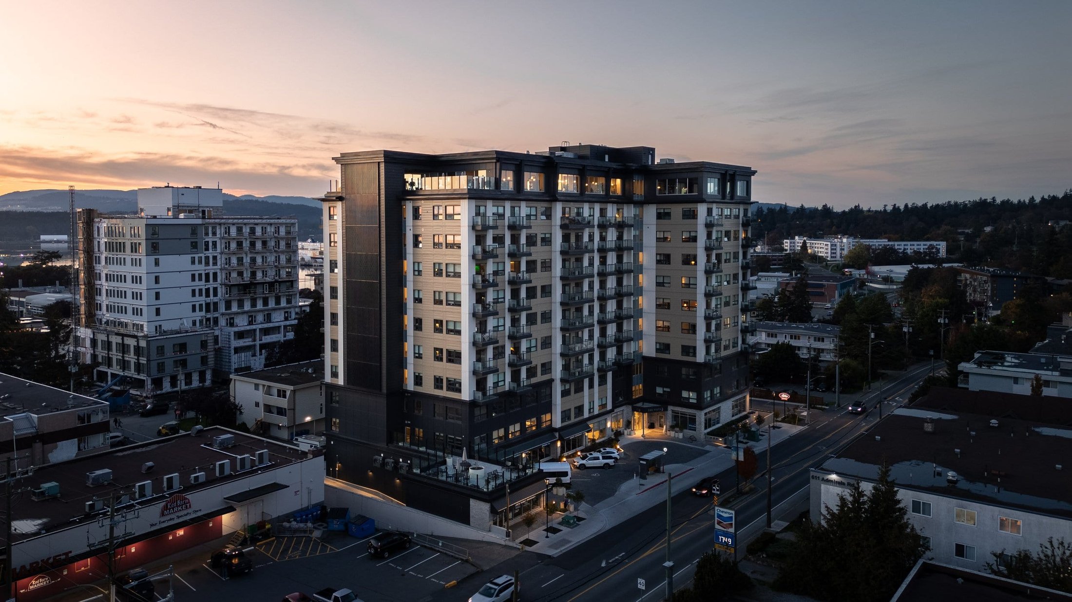 Twilight aerial view of a condo highrise tower in Victoria BC